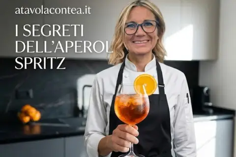 Donna sorridente con un bicchiere di Spritz Aperol, guarnito con arancia. Scopri i segreti degli ingredienti Spritz Aperol perfetti.